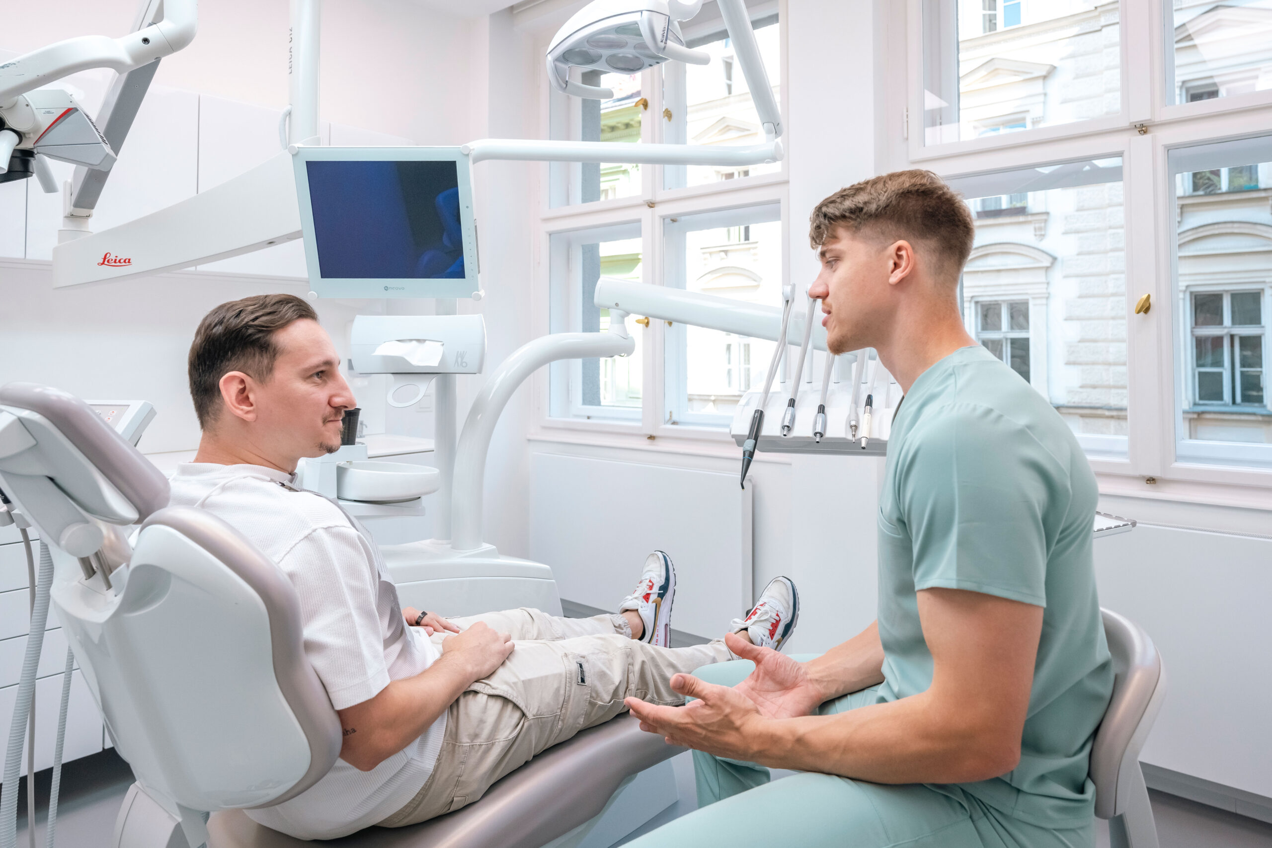 Dentist consulting treatment with a patient in a clinic